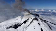 Main image for Mount Etna Eruption Continues as Skier Glides Down Slopes.