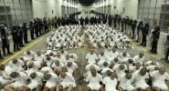 Main image for Over 200+ Alleged Venezuelan Gang Members Deported to El Salvador's Mega-Prison