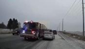 Main image for Close Call: Firetruck Narrowly Avoids Collision with Car.
