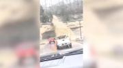 Main image for Waterfall Surges Onto Road in Madison, Indiana.