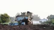 Main image for Robot Bulldozers Break Ground in Gaza War Effort.