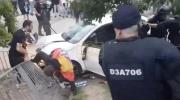 Main image for 13 Injured When Car Plows Into Crowd.
