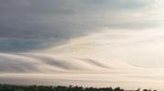 Main image for Fog Tsunami Swallows Lake Michigan.