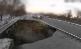 Main image for Dashcam Video Shows Drivers Staring Into Sudden Sinkhole.