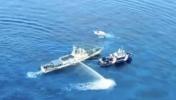 Main image for China Blasting the Philippine Coast Guard with Water Cannon. 