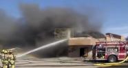 Main image for Firefighters Dodge Disaster as Roof Collapses.