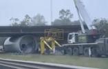 Main image for Massive Wind Turbine Stuck Under Bridge After Truck Misses Turn in Queensland. 