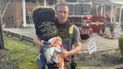 Main image for Firefighter Rescues Torah Scroll from Synagogue Blaze in Greenvale. 