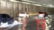 Main image for Cars Plow Through Flooded Streets. 