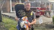 Main image for Firefighter Rescues Torah Scroll from Synagogue Blaze in Greenvale. 