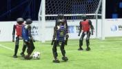 Main image for Humanoid Robots Go Head-to-Head in Soccer Match.
