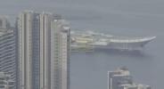 Main image for China's Shandong Aircraft Carrier Makes Historic First Arrival in Hong Kong With Full Battle Group. 