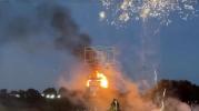 Main image for Anti-Migrant Protesters Burn Refugee Boat Effigy at Northern Ireland Bonfire. 