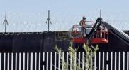 Main image for U.S. Military Reinforces Southern Border Wall with Barbed Wire.