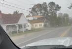 Main image for Roof Flies Off Building, Nearly Hits Car in Wild Maine Storm. 