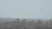 Main image for Plane Airdrops Humanitarian Aid Over Central Gaza Amid Ongoing Conflict.