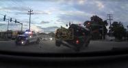 Main image for Police Cruiser Slams Truck in Red-Light Crash. 