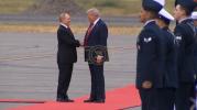 Main image for President Trump and PM Putin Lock Hands in Alaska. 