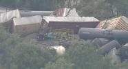 Train Cars Pile on Top of One Another in Fiery Derailment.
