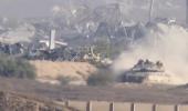 Main image for Israeli Tanks Mass at Gaza Border.
