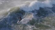 Main image for Surfers Ride Massive Hurricane Erin Waves. 