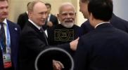 Main image for Putin and Modi Walk Hand-in-Hand to Meet Xi.