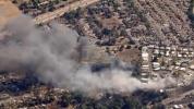 Main image for A Fast Moving Brushfire Destroys Homes in Lakeside, California. 