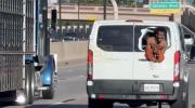 Main image for WILDFOOTAGE: Oklahoma Inmate Hangs Out of Prison Van in Daring Escape Attempt.