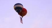 Main image for Giant U.S. Flag Soars From Hot Air Balloons.