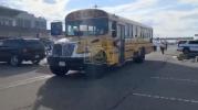 Main image for School Buses Await Uman Passengers At JFK. 