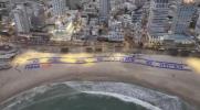 Main image for Giant Trump Tribute Unveiled on Tel Aviv Beach.