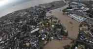 Main image for Typhoon Tino Submerges Philippines Neighborhoods as Floodwaters Reach Rooftops.