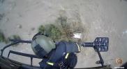 Main image for Helicopter Team Saves Three People From Submerged SUV in Raging Flood.