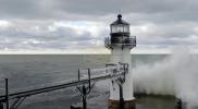 Main image for Winter Storm Freezes Lake Michigan Pier in Striking Icicle Display.
