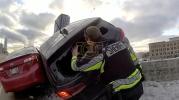Main image for Bodycam Captures Dramatic Rescue of FBI Agent From Suspended Vehicle.