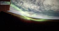Main image for FROM SPACE: Green Auroras Light Up Earth in Rare Space View.