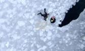 Main image for Dramatic Ice Rescue as NYPD Scuba Team Saves Three in Queens.
