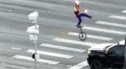 Main image for Police Drone Films Fire-Juggling Unicyclist Stopping Traffic.