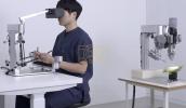 Main image for Precision Surgery Breakthrough: Sony's Robot Demonstrates Tiny Stitches on Corn.
