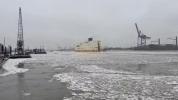 Main image for Green Ferry Battles Thick Ice on Frozen River.