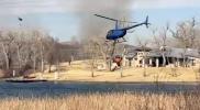 Main image for Aerial Water Drops Slow Lavender Fire Spread in Texas.