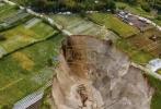 Main image for WILD FOOTAGE: Ground Collapse Swallows 30,000 Square Meters of Land in Indonesia.