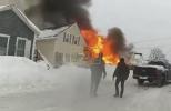 Main image for Dramatic Bodycam Shows Dig Through Snow to Reach Hydrants During House Fire.