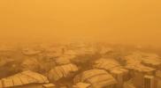 Main image for Eerie Orange Skies: Gaza City Disappears Under Massive Orange Dust Storm.