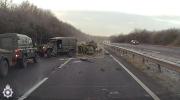 Main image for Military Convoy Crash Leaves Two Injured as Driver Is Thrown From Army Truck.