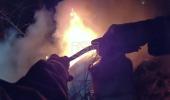 Main image for Dramatic Bodycam Shows NYPD Officers Pull Victims From Burning Car in Queens. 