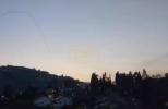 Main image for Dramatic Footage Captures Israeli Missile Obliterating Incoming Hezbollah Aerial Threat Over Metula as Smoke Trails Scar the Twilight Sky.