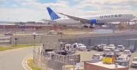 Main image for Another Video: Surveillance footage shows the moment United Airlines Flight strike a light pole into Newark Liberty International Airport.