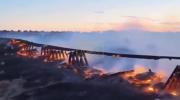 Main image for Texas Fire Devastates Railroad Bridge.