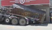 Main image for Massive Dump Truck Crashes Over in Brooklyn's Borough Park: Heavy Container Smashes Sidewalk Near Target Store.